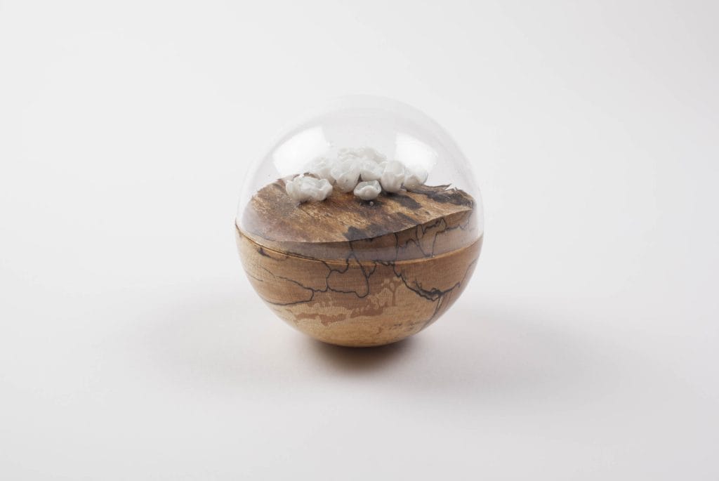 Un/Natural 9 Half wood, half glass orbs with glass lichen inside