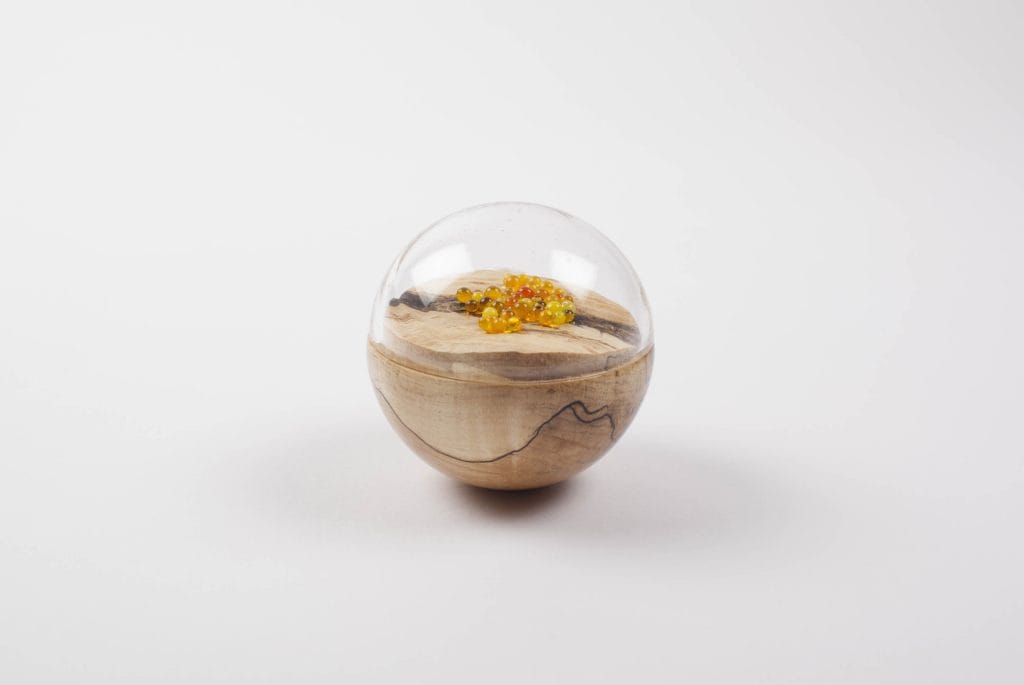 Un/Natural 4 Half wood, half glass orbs with glass lichen inside