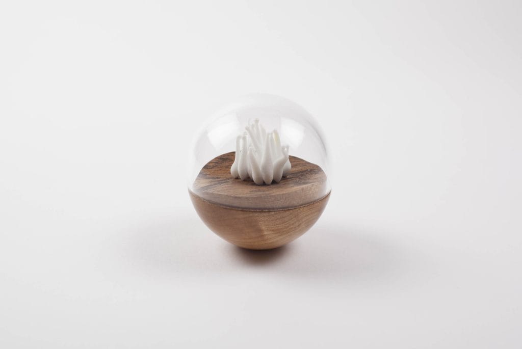 Un/Natural 2 Half wood, half glass orbs with glass lichen inside