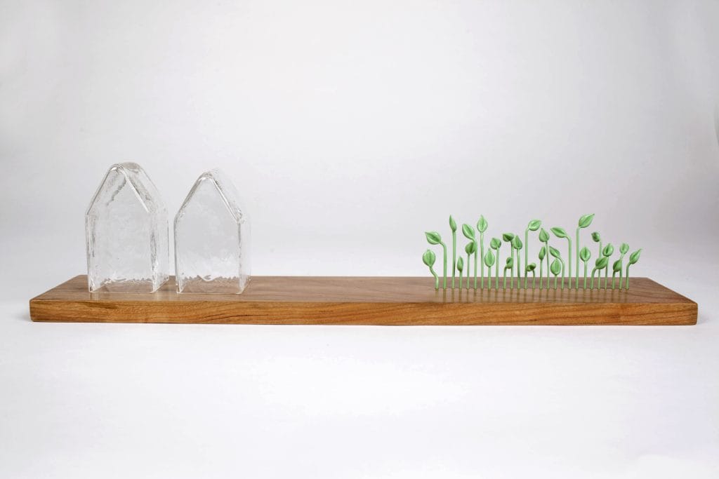 Un/Natural 16 Sculpture with glass houses and small glass sprouts in a line