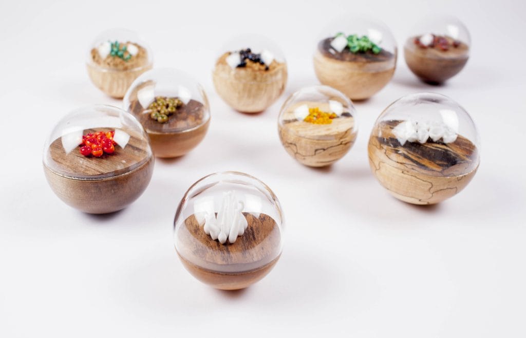 Un/Natural 11 Half wood, half glass orbs with glass lichen inside